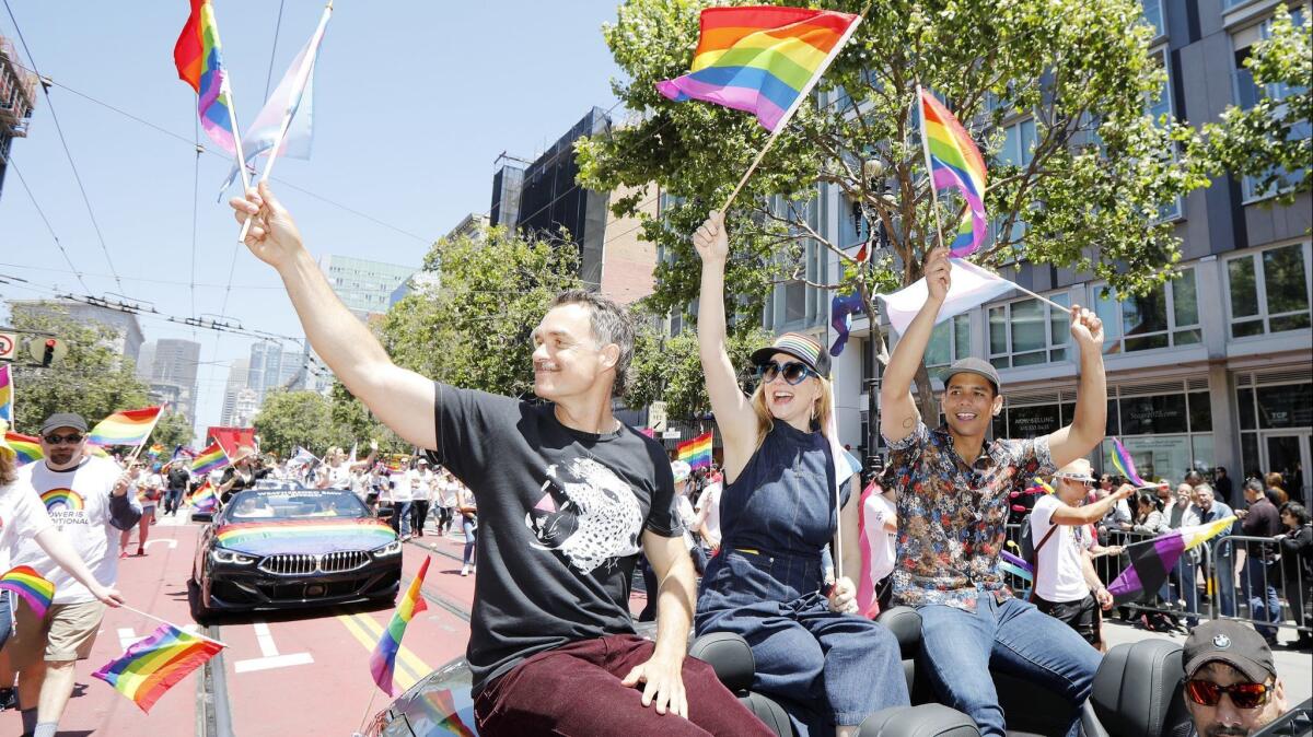 Murray Bartlett, left, Laura Linney and Charlie Barnett at the 2019 San Francisco gay pride parade, which was blocked for an hour by protesters.