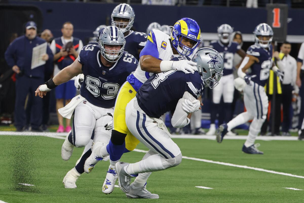 Rams defensive tackle Aaron Donald sacks Dallas Cowboys quarterback Dak Prescott.