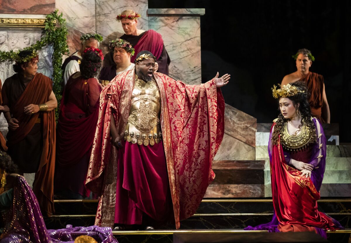 Russell Thomas as Titus, left, and Guanqun Yu as Vitellia.