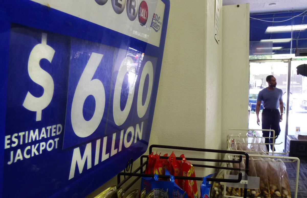 An advertising board shows the record jackpot of the Powerball lottery with a record jackpot of $600 million.