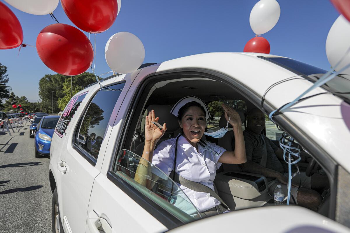 Chaffey College student Jessica Reyes at a drive-through graduation ceremony