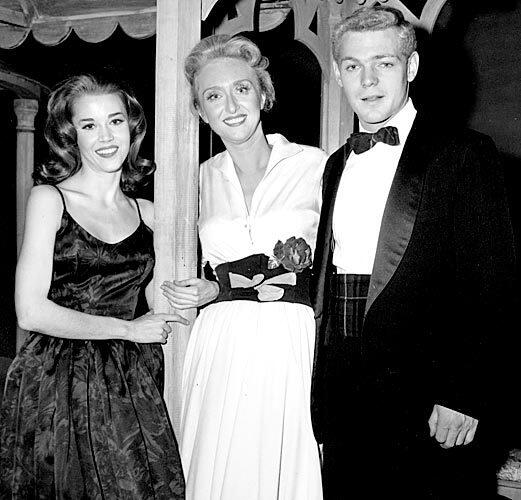 James MacArthur poses with Jane Fonda, left, and Celeste Holm, starring in the play "Invitation to a March," outside the Music Box Theatre in New York on opening night in 1960. See full story