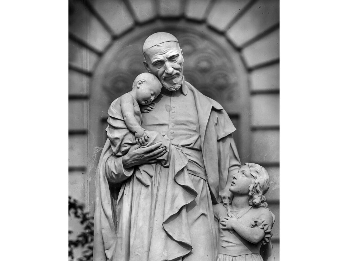 December 1955: Miniature statue of St. Vincent de Paul and the children that stands on the lawn in front of St. Vincent's Hospital on W. 3rd St. at Alvarado Street.
