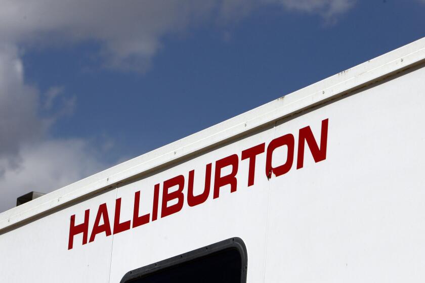 Halliburton anticipates laying off 6.5% to 8% of its global workforce, which amounts to 5,200 to 6,400 employees. Above, the Halliburton logo adorns the side of a machine at a natural gas production site in Rulison, Colo., in 2009.