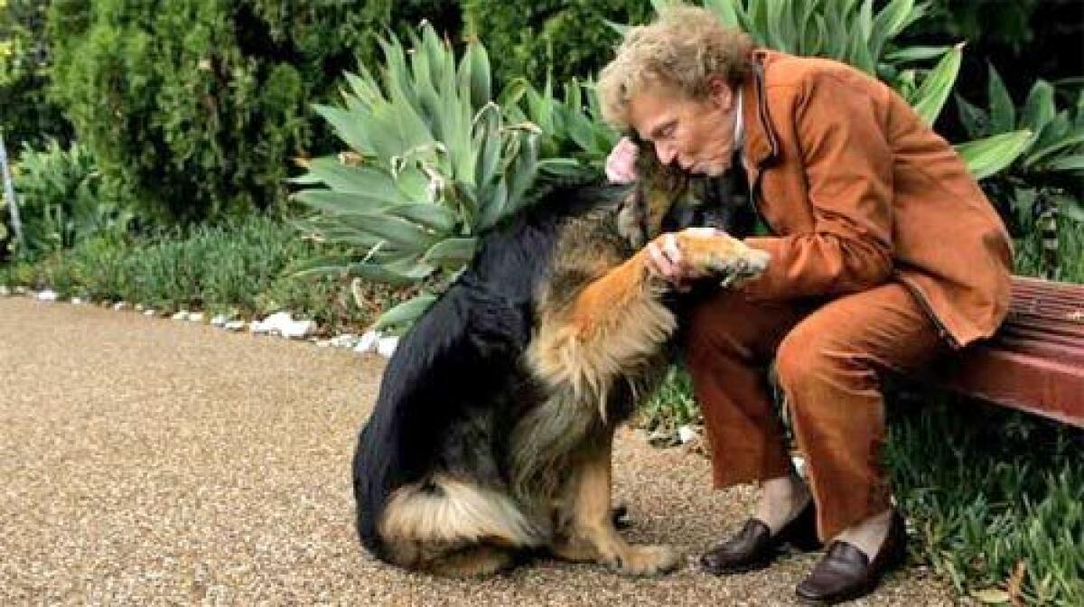 REMEMBERING: Rita Kittower spends a moment with Bruin at her home in Tarzana. She used to enjoy walking the dog with her husband, Elmore, whose recent death at a Calabasas assisted living facility is under investigation.