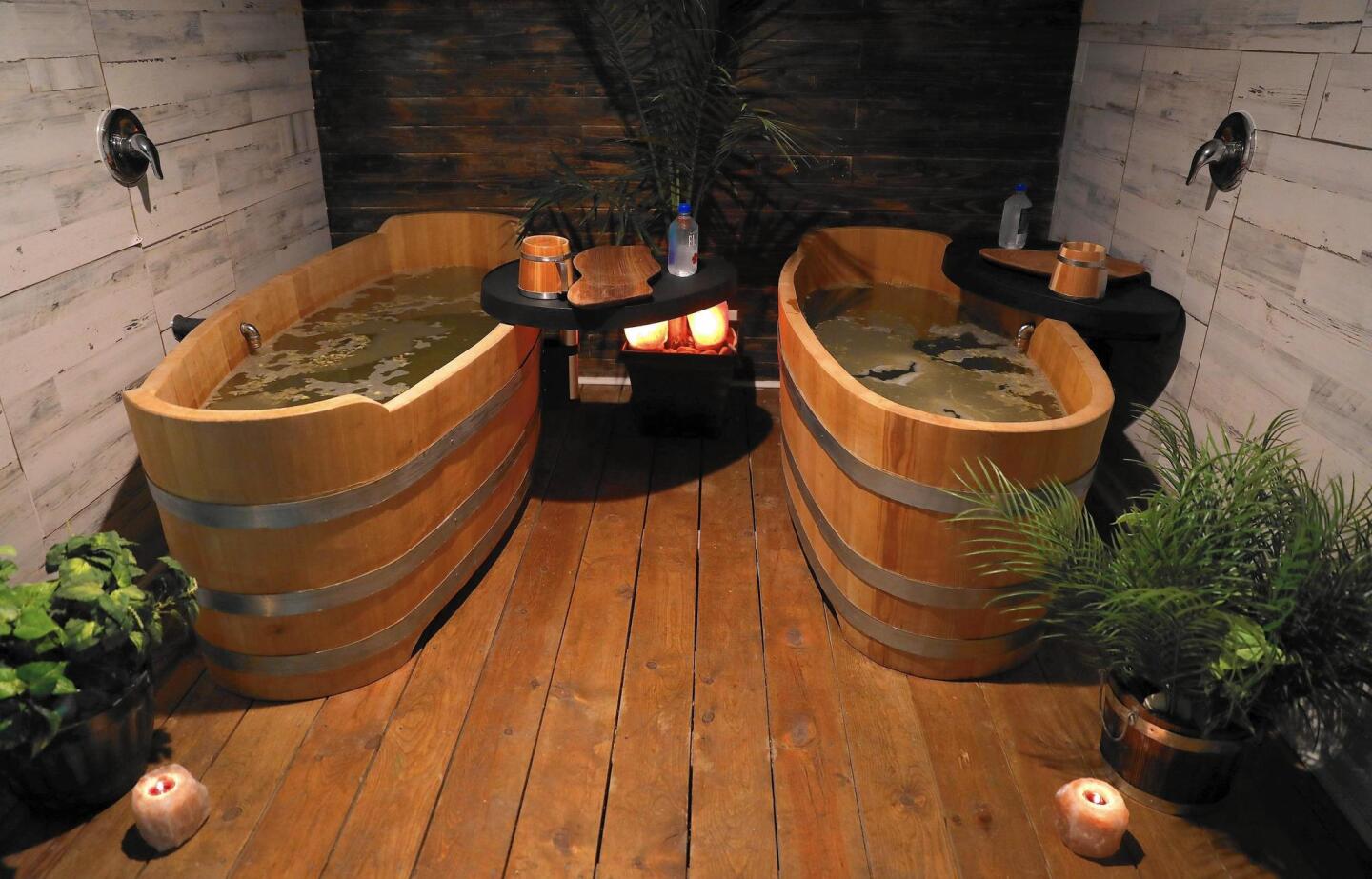 Patrons soak in a larch wood tubs filled with hops, yeast, herbs and beer at Piva Beer Spa.