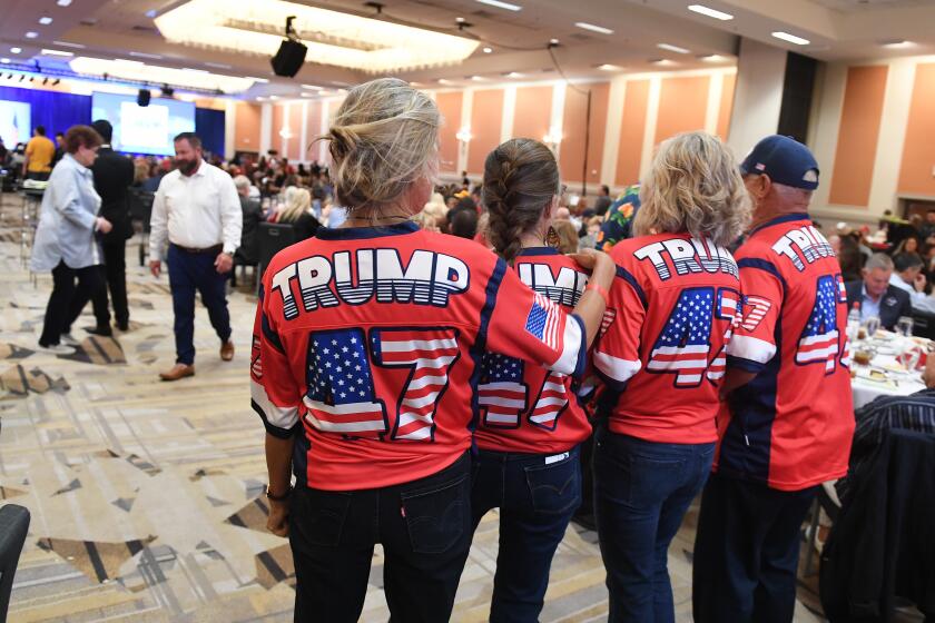 Anaheim, California September 29, 2023-Trump supporters celebrate before former President Donald Trump speaks at the CAGOP convention in Anaheim Friday. (Wally Skalij/Los Angeles Times)