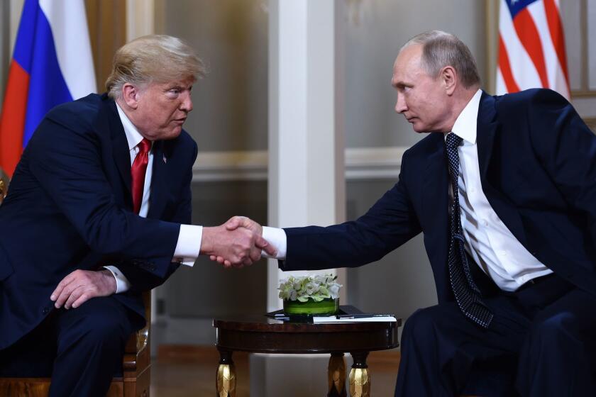 Trump and Putin shake hands ahead of their private meeting on Monday. Before their one-on-one session, Trump said to Putin, “We have a lot of questions, and hopefully we'll come up with answers. It's great to be with you.”