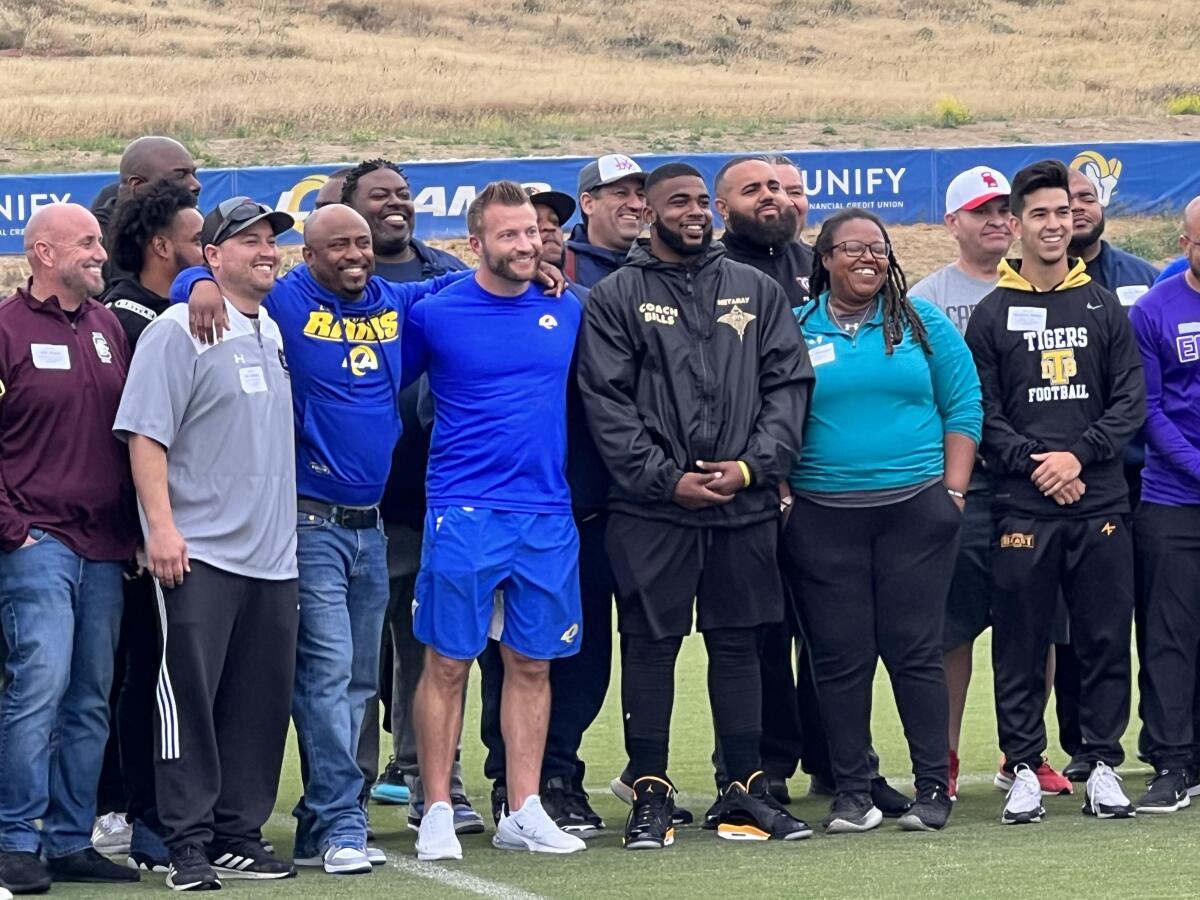 Rams coach Sean McVay poses with more than 60 high school football coaches at Rams training camp. 