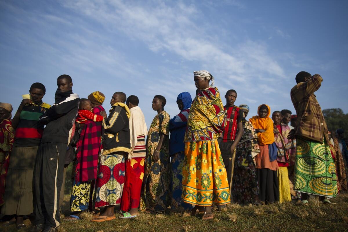 Residents line up prior to casting their vote in the village of Buye, Burundi, on July 21, 2015.