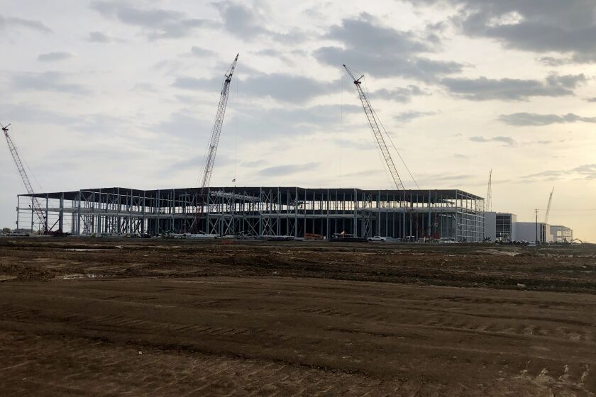 Construction continues on the plant, part of a $5.6 billion joint project by Ford Motor Co. and battery maker SK on Friday, March 24, 2023 in Stanton, Tenn. Ford says its new assembly plant being built in western Tennessee will be able to build up to 500,000 electric pickup trucks per year at full production. (AP Photo/ Adrian Sainz)