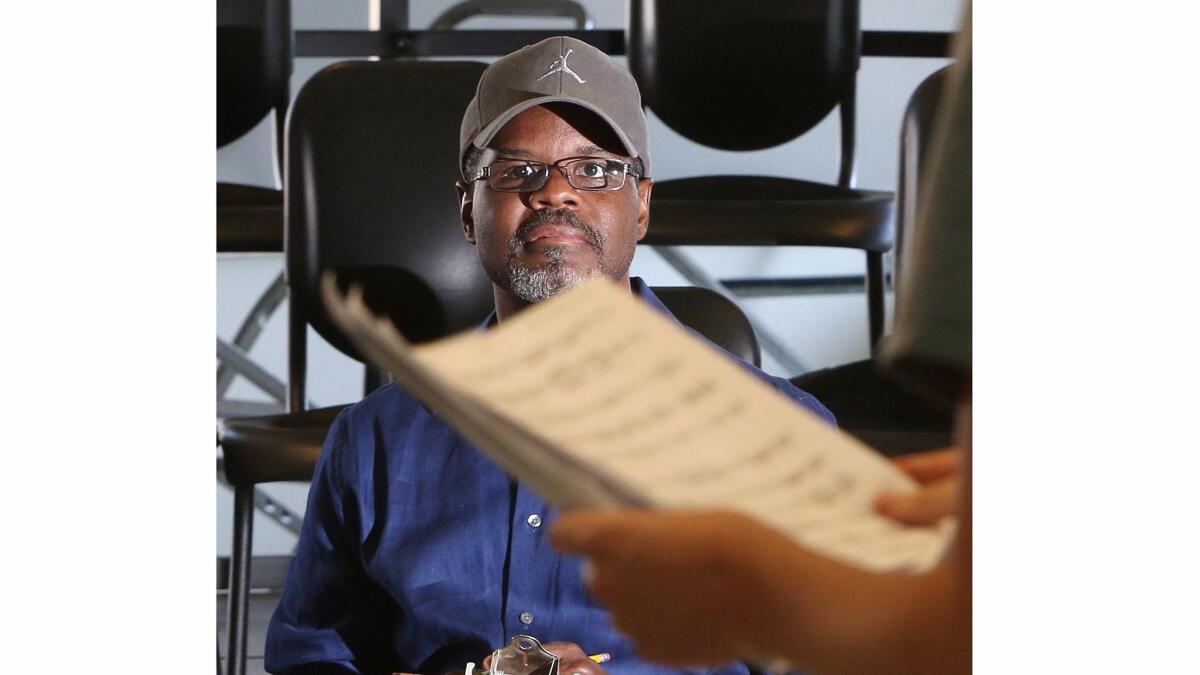 Orlando Alexander, the director for the upcoming production of Les Miserables, evaluates candidates at an audition at La Cañada High School Monday. Alexander was the choreographer for this year's Emmy Awards.