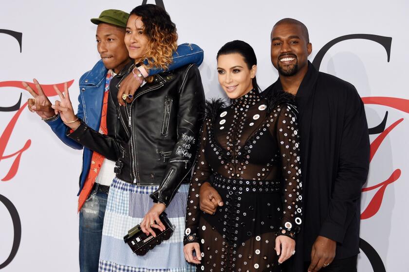 From left, Pharrell Williams, Helen Lasichanh, Kim Kardashian and Kanye West, who presented the Style Icon Award to Williams at the 2015 CFDA Fashion Awards in New York.