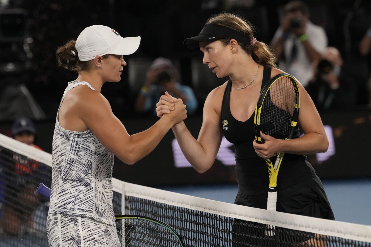 Ashleigh Barty, left, and Danielle Collins meet at the net after Saturday's Australian Open final.