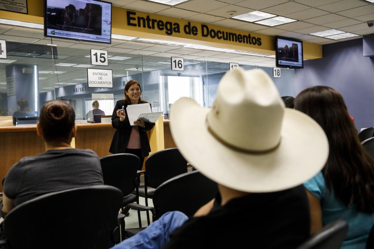 Lorena Ojeda speaks about services available from Planned Parenthood in the waiting area at the Mexican Consulate in Los Angeles on July 16.