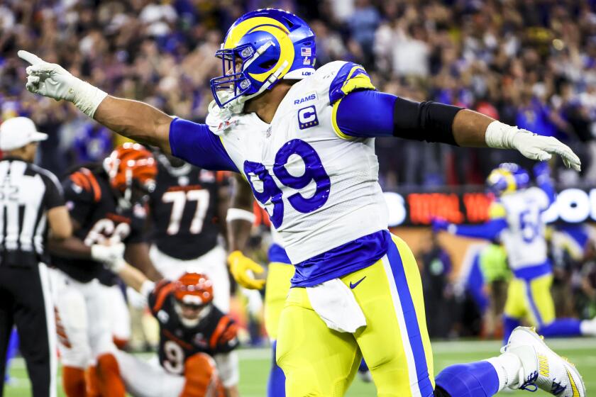 Los Angeles Rams defensive end Aaron Donald (99) celebrates his sack of Cincinnati Bengals quarterback Joe Burrow