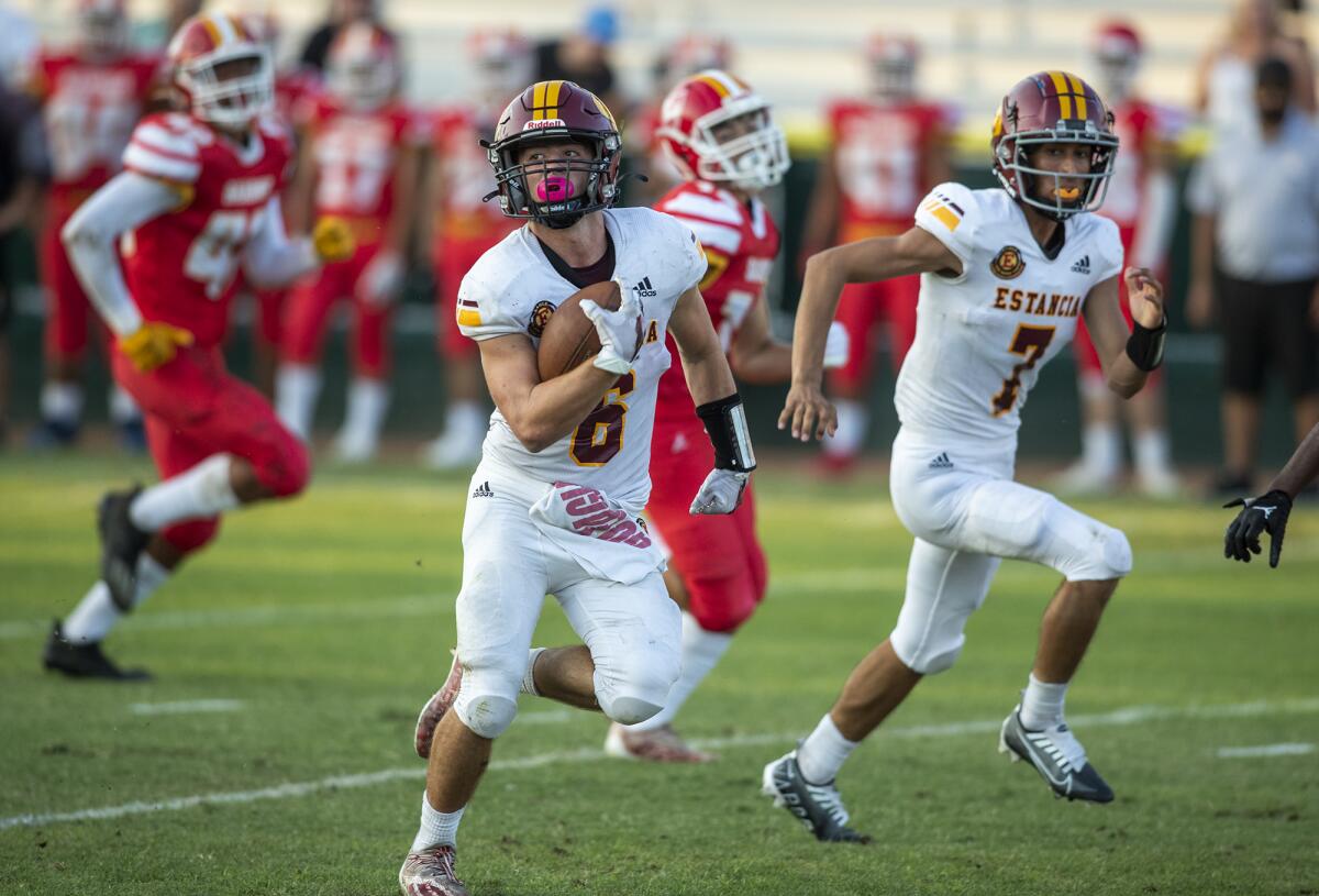 Estancia's Noah Aires runs up field for a touchdown during a game against Loara at Glover Stadium in Anaheim on Thursday.