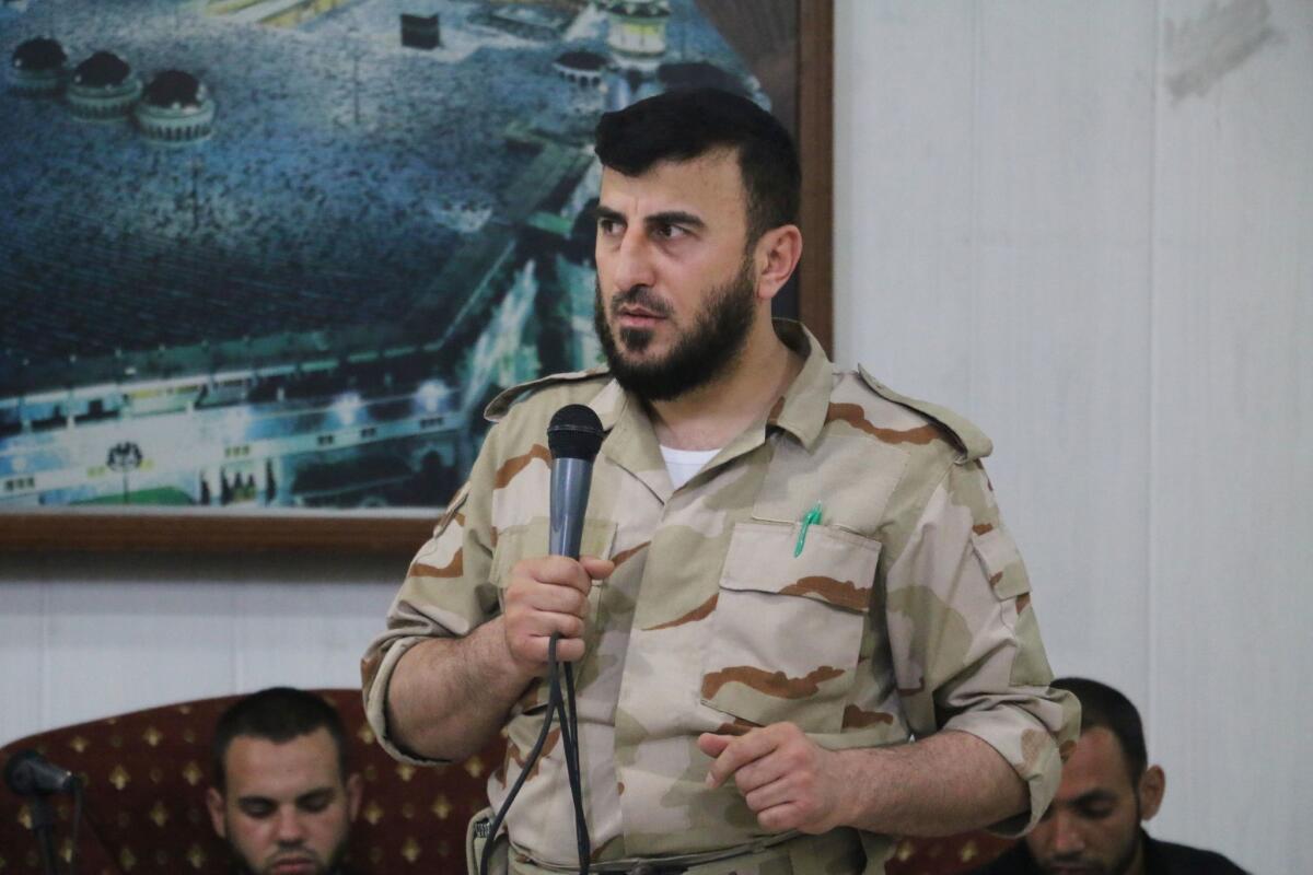 Zahran Alloush, head of the Islam Army, a Syrian rebel group, speaks during the wedding of a fighter in the group on July 21, 2015, in the rebel-held town of Douma, Syria. Alloush was reported killed in an air strike on Friday.