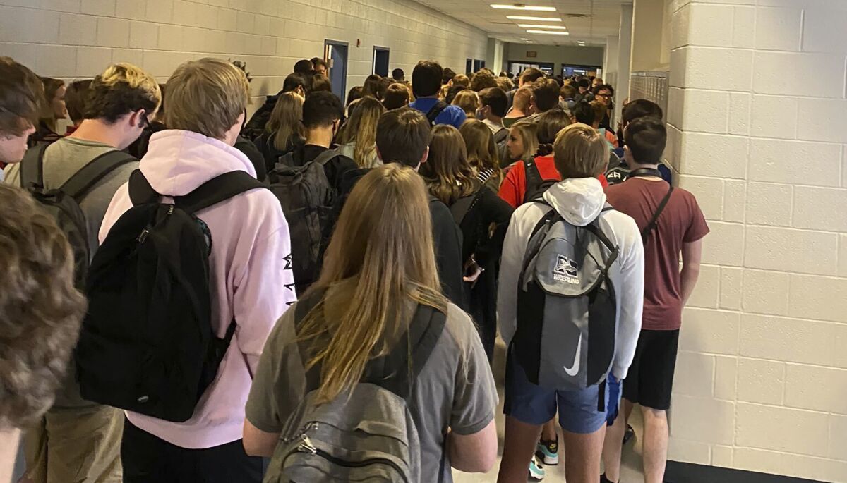 Students crowd a hallway at North Paulding High School in Dallas, Ga.   