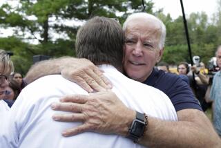 Democratic presidential candidate and former Vice President Joe Biden hugs a supporter at the Polk County Democrats Steak Fry, in Des Moines, Iowa, Saturday, Sept. 21, 2019. (AP Photo/Nati Harnik)
