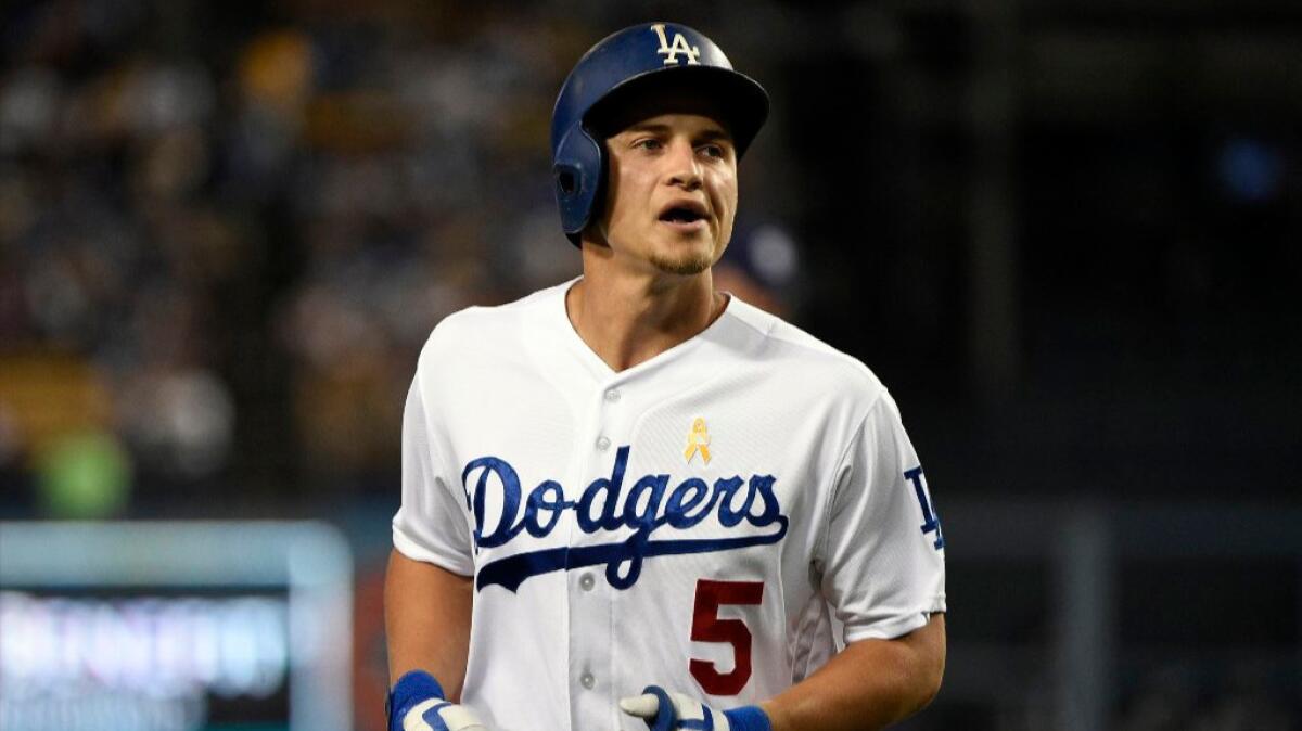 Dodgers shortstop Corey Seager runs back to the dugout during the first inning of a game against the Padres on Sept. 2.