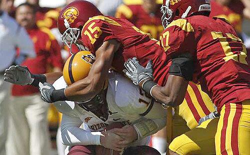 USC cornerback Kevin Thomas sacks Arizona State quarterback Rudy Carpenter in the first half Saturday.