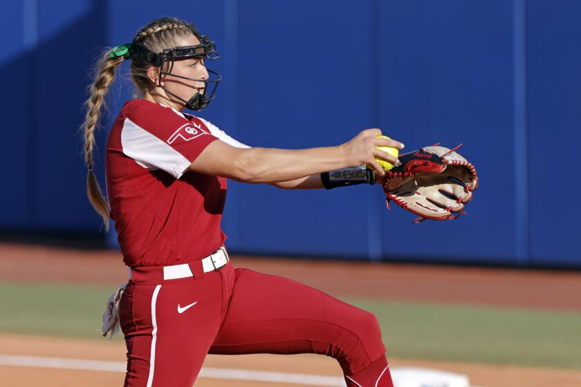Oklahoma's Alex Storako pitches against Florida State during the first inning of the second game of the NCAA Women's College World Series softball championship series, Thursday, June 8, 2023, in Oklahoma City. (AP Photo/Nate Billings)