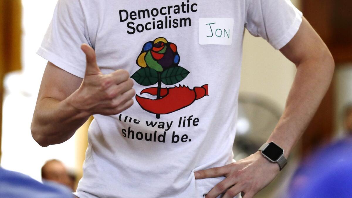 A member of the Southern Maine Democratic Socialists of America participates in a discussion at City Hall in Portland, Maine.