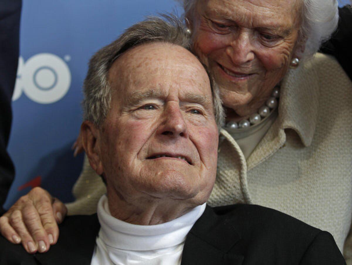 Former President George H.W. Bush, shown in June with wife Barbara, has been moved into a regular patient room at Methodist Hospital in Houston.