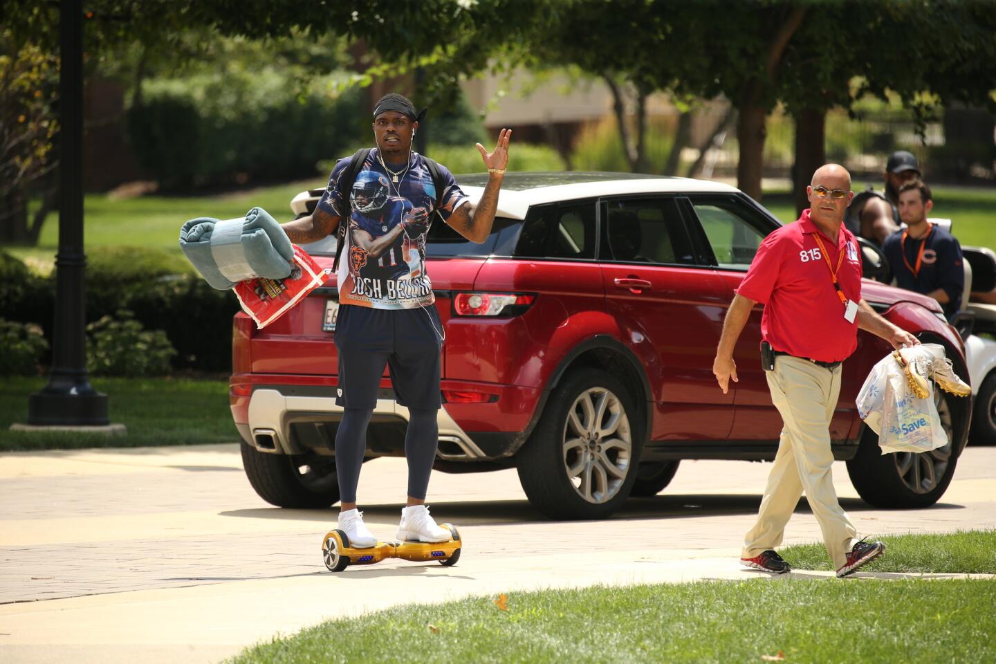 Bears wide receiver Josh Bellamy arrives for training camp on his hoverboard (and his likeness on his t-shirt).