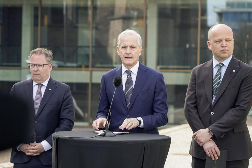 Norway's Prime Minister Jonas Gahr Støre, centre, Finance Minister Trygve Slagsvold Vedum, right and Defense Minister Bjørn Arild Gram, take part in a press conference on defense at SMK, in Oslo, Thursday, May 2, 2024. The Norwegian center-left government wants to add 7 billion kroner ($630 million) to the Scandinavian country’s Armed Forces on top of the hefty increase of the defense budget announced last month. (Terje Pedersen /NTB Scanpix via AP)