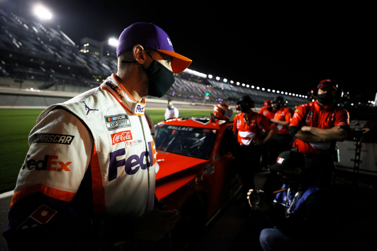 Denny Hamlin walks on pit road during qualifying for the Daytona 500 on Wednesday.