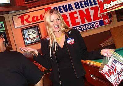 Gubernatorial candidate Reva Renee Renz gives away the last of her campaign postcards to patrons at Deva's Bar, a lounge she owns in Tustin.