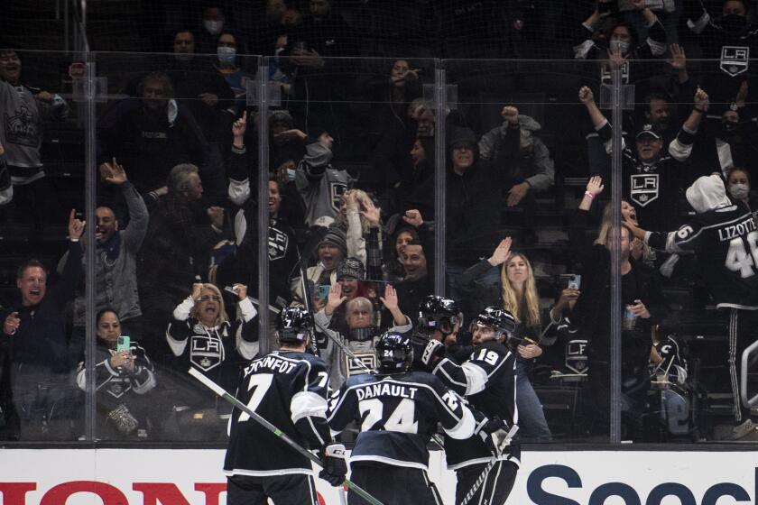 Los Angeles Kings celebrate a goal by right wing Adrian Kempe, second from right, during the third period of an NHL hockey game against the St. Louis Blues on Wednesday, Nov. 3, 2021, in Los Angeles. (AP Photo/Kyusung Gong)