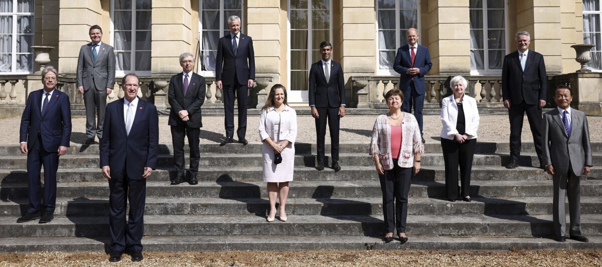 G-7 finance ministers pose, socially distanced, on steps  