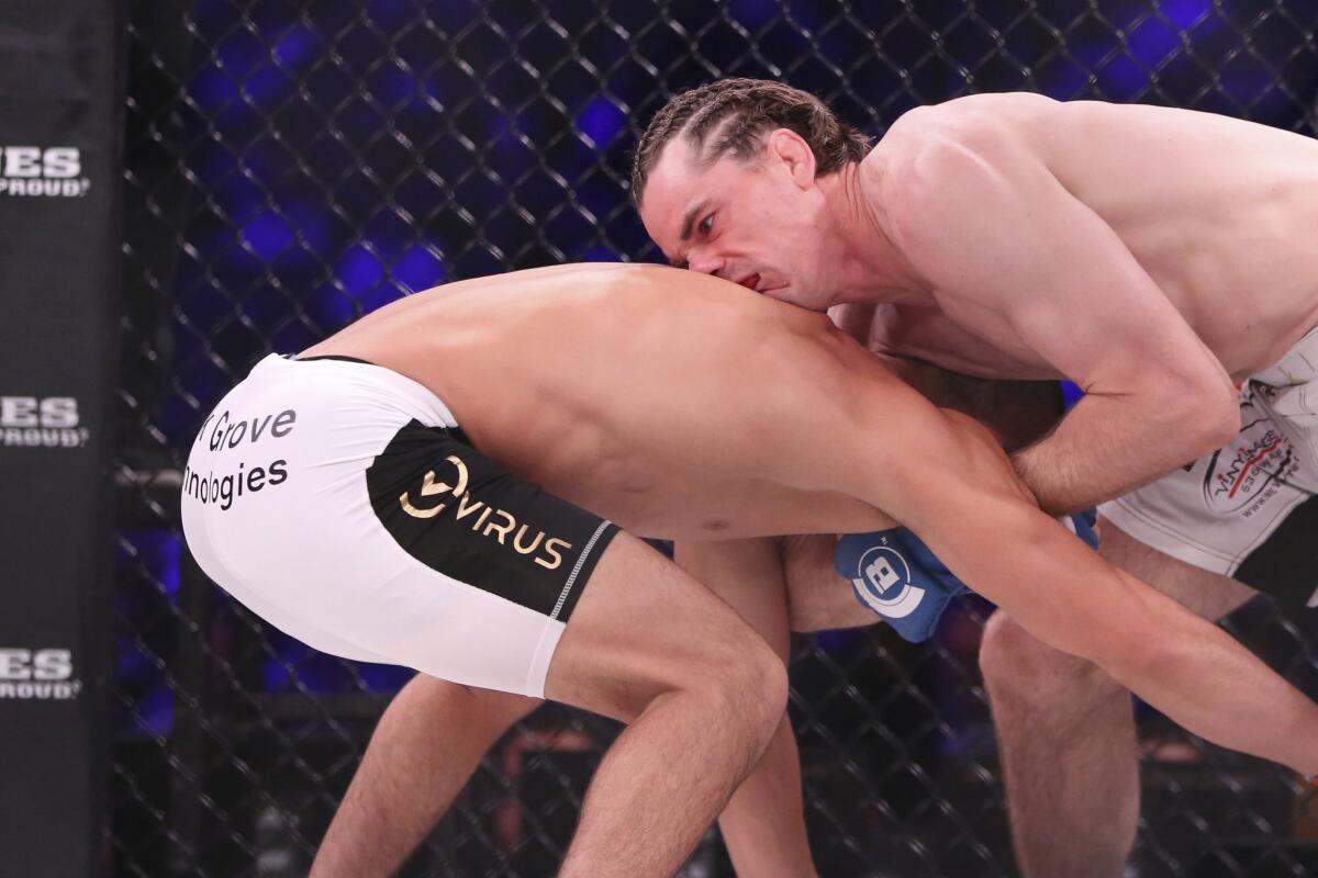 Zach Freeman, right, grapples with Aaron Pico before securing a choke during the bout at Bellator NYC.