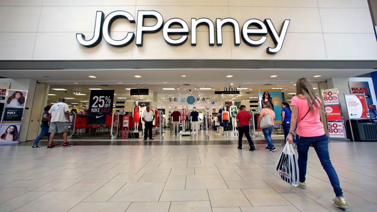Shoppers walk into a J.C. Penney in Hialeah, Fla., on June 7