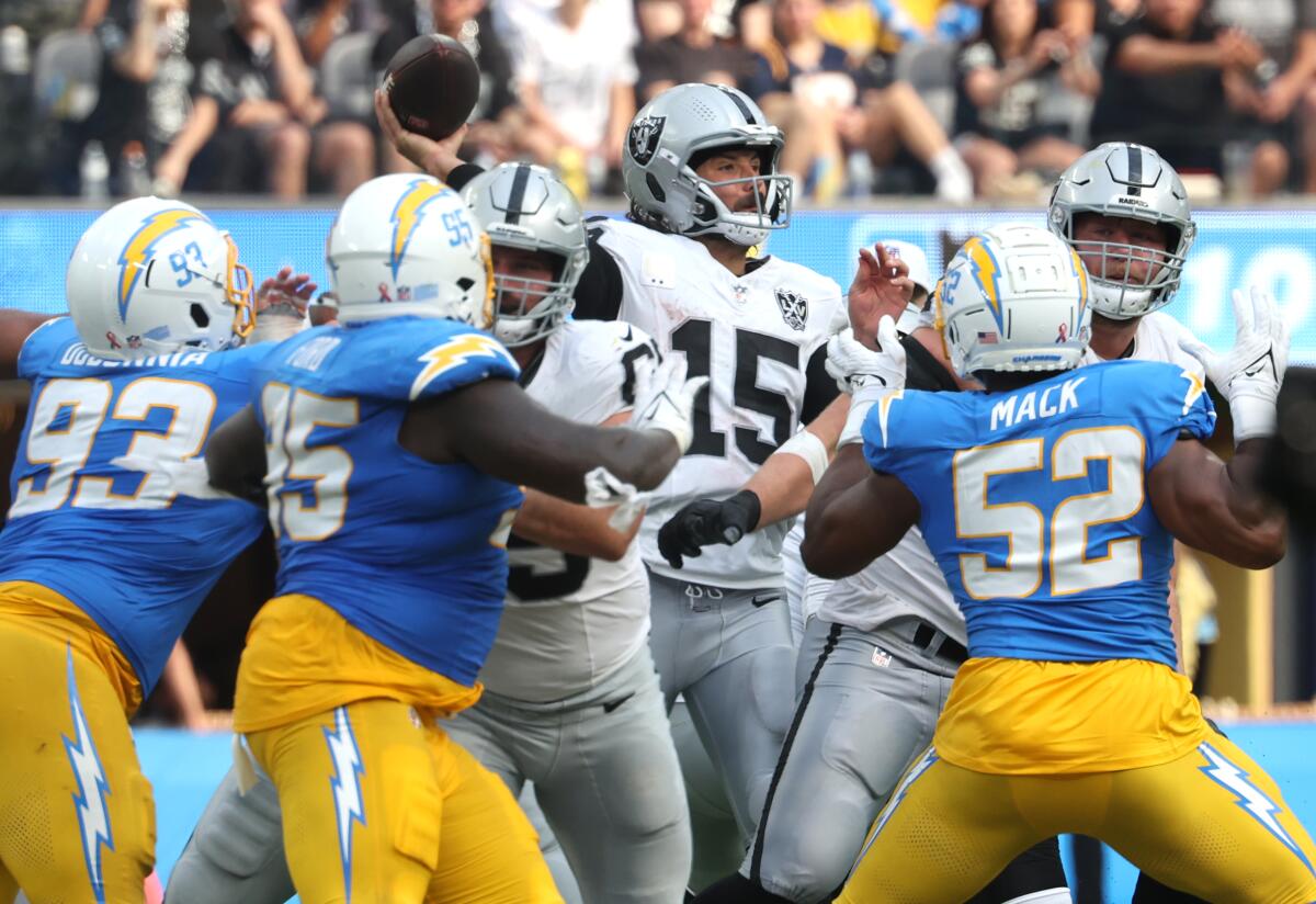 Chargers defenders pressured Raiders quarterback Gardner Minshew II (15) in the second half.