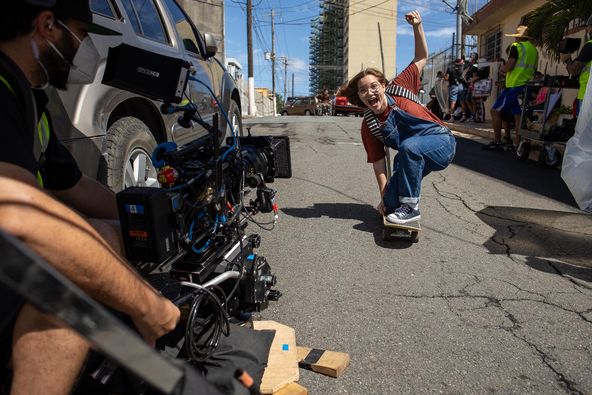 Melanie Ramos skates for the camera as filming resumes on "Simone."