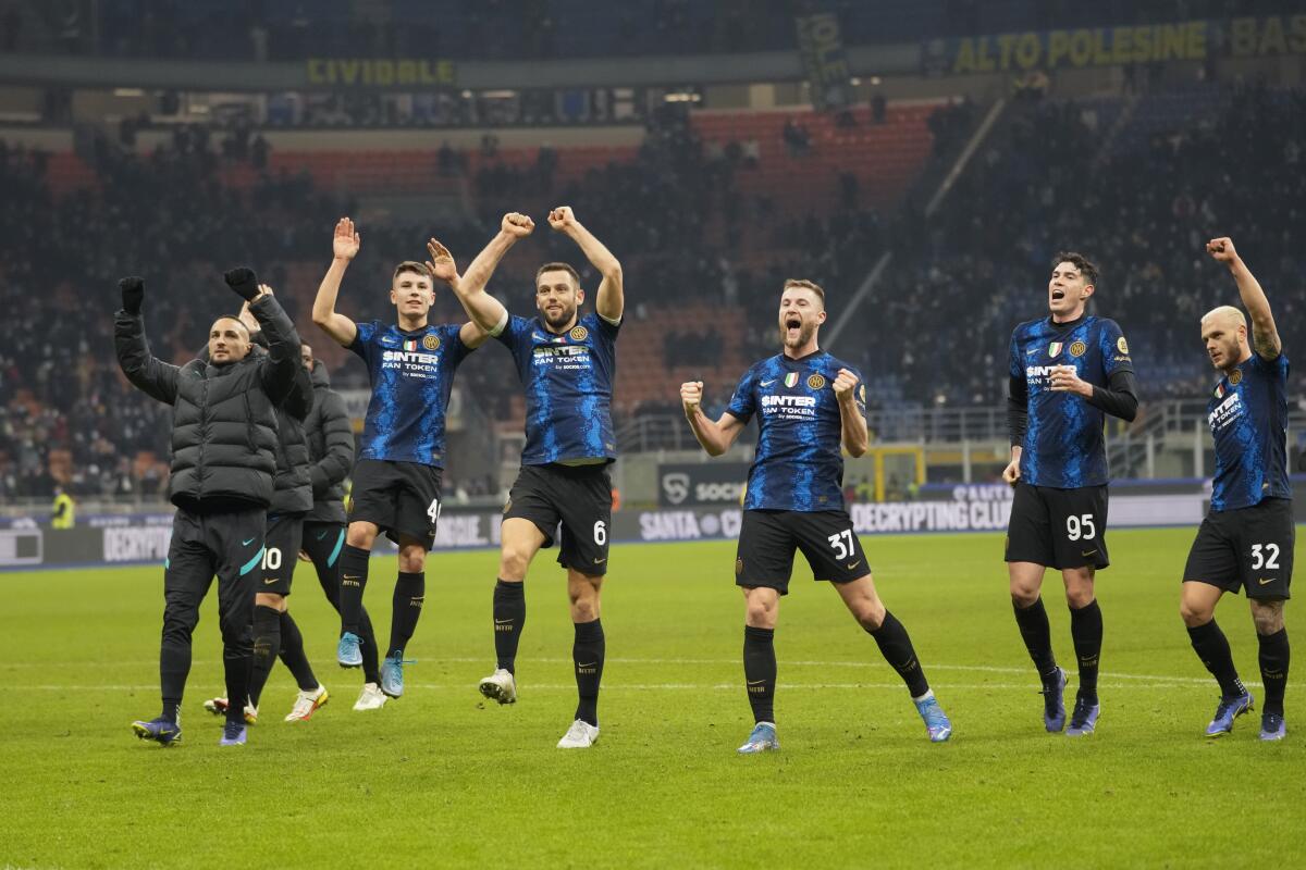 Inter Milan players celebrating taking the lead in the Serie A after winning the match between Inter Milan and Cagliari.