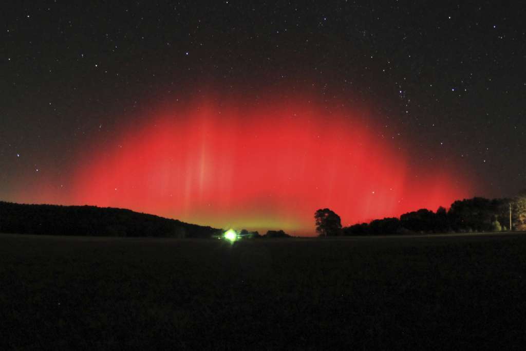 An aurora borealis lights up the Ozark, Ark., sky in October 2011. In the current solar cycle, two peaks have occurred: in 2011 and 2014.