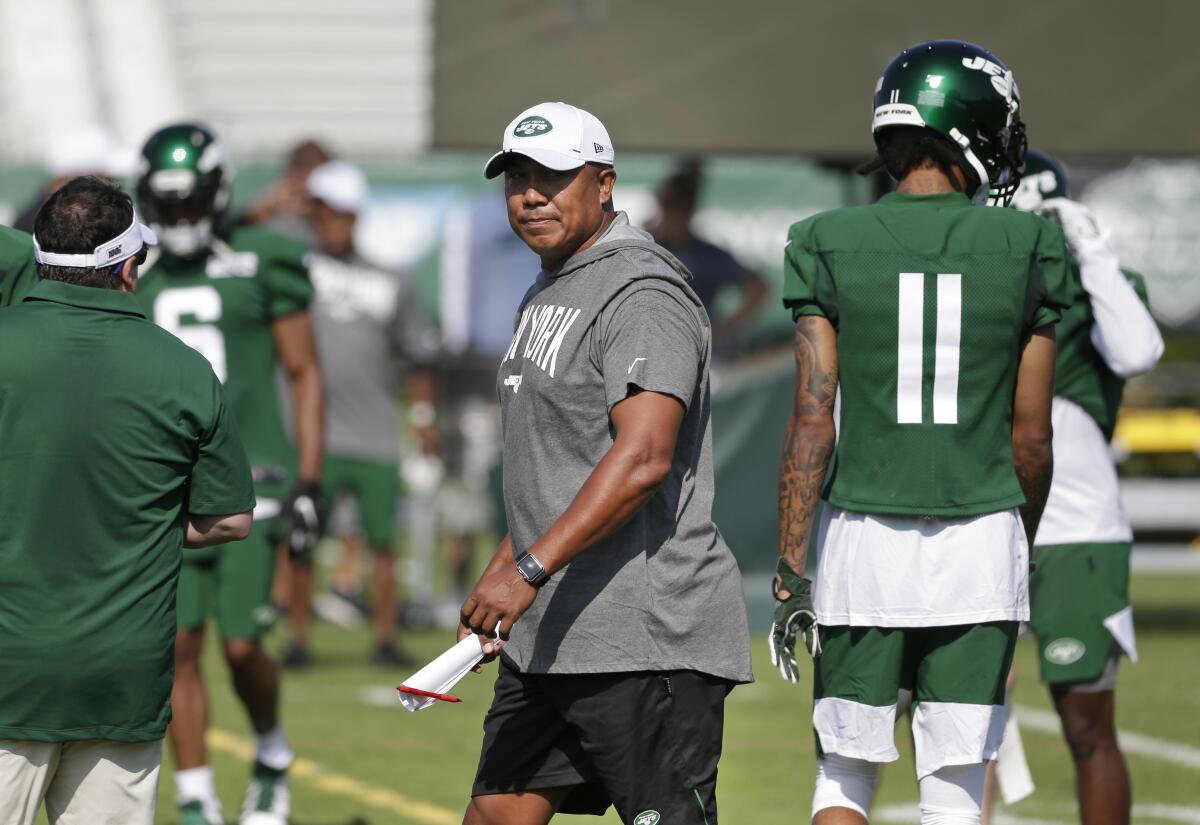 FILE - Hines Ward, at the time the New York Jets' offensive assistant coach, walks on the field during the NFL football team's training camp in Florham Park, N.J., July 25, 2019. Ward is getting his first opportunity to be a head coach with San Antonio in the new XFL. The league relaunches in February 2023. (AP Photo/Seth Wenig, File)