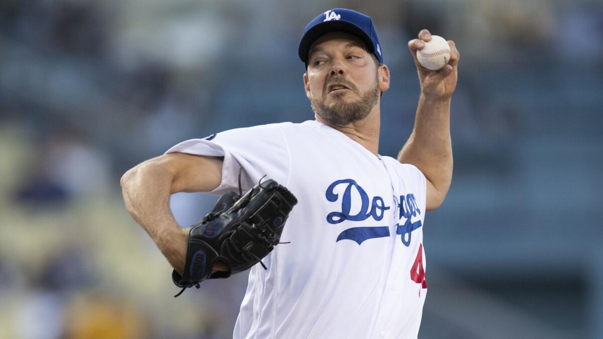 Dodgers starting pitcher Rich Hill throws during the first inning against the Chicago Cubs on Friday at Dodger Stadium.