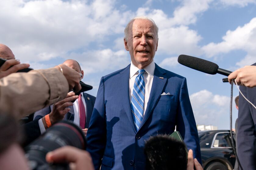 President Joe Biden speaks to the media before boarding Air Force One at Des Moines International Airport on April 12, 2022