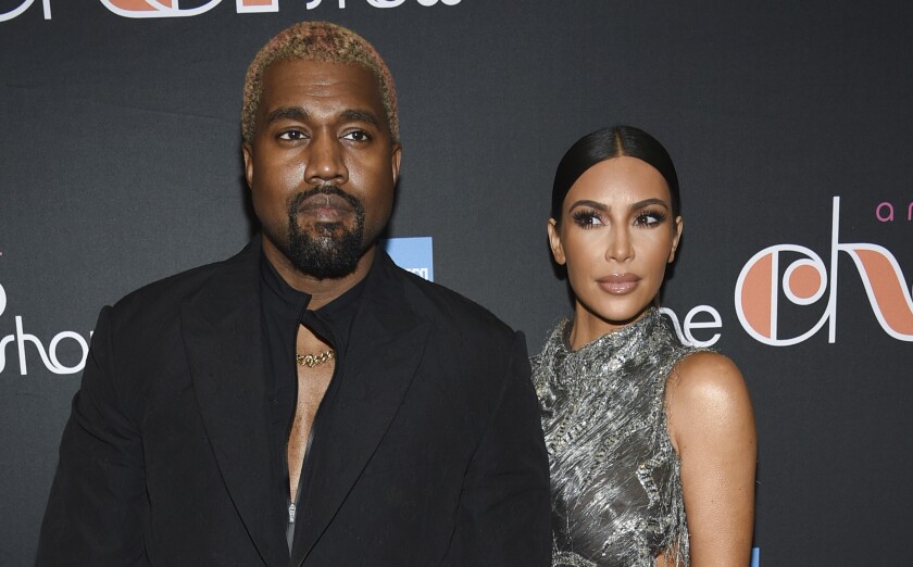 FILE - Kanye West and Kim Kardashian West attend "The Cher Show" Broadway musical opening night on Dec. 3, 2018, in New York. West agrees with Kardashian West that they should have joint custody of their four children and neither of them need spousal support, according to divorce documents filed by West's attorneys in Los Angeles Superior Court on Friday, April 12, 2021. Kardashian West filed to end the couple's 6 1/2-year marriage in February. (Photo by Evan Agostini/Invision/AP, File)