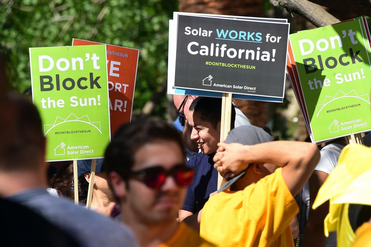 Solar proponents have been rallying to block changes to rooftop solar costs. On Tuesday, state regulators proposed new fees for solar customers.