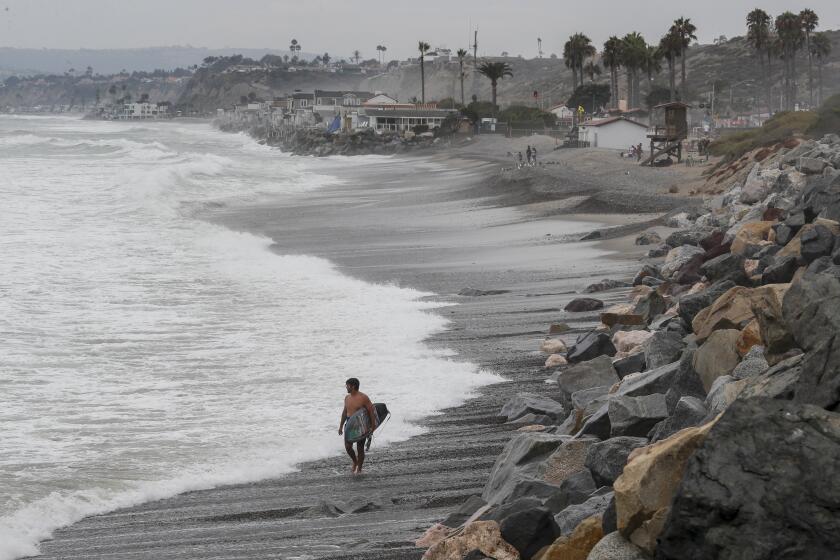 San Clemente, CA, Thursday, August 5, 2022 - High tide near San Clemente's North Beach at Dije Court. San Clemente City Council is proposing an abortion ban. (Robert Gauthier/Los Angeles Times)