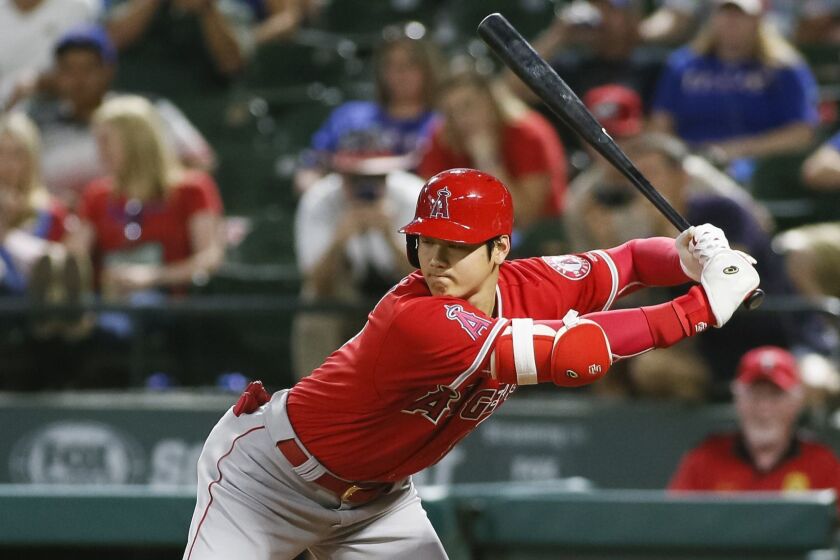 Los Angeles Angels' Shohei Ohtani gets out of the away of an inside pitch by Texas Rangers relief pitcher Eddie Butler during the eighth inning of a baseball game Wednesday, Sept. 5, 2018, in Arlington, Texas. (AP Photo/Ray Carlin)