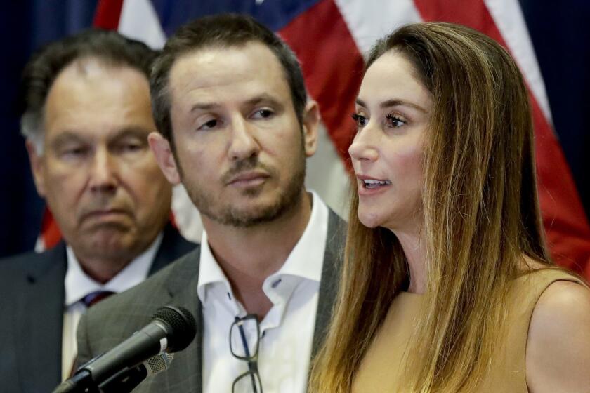 Jeanne Bernstein, right, and her husband Gideon, parents of murder victim Blaze Bernstein, speak during a news conference as Orange County District Attorney Tony Rackauckas, left, looks on Thursday, Aug. 2, 2018, in Santa Ana, Rackauckas, said Thursday they will file a hate crime sentencing enhancement against 21-year-old Samuel Woodward in the murder of 19-year-old sophomore Blaze Bernstein. (AP Photo/Chris Carlson)
