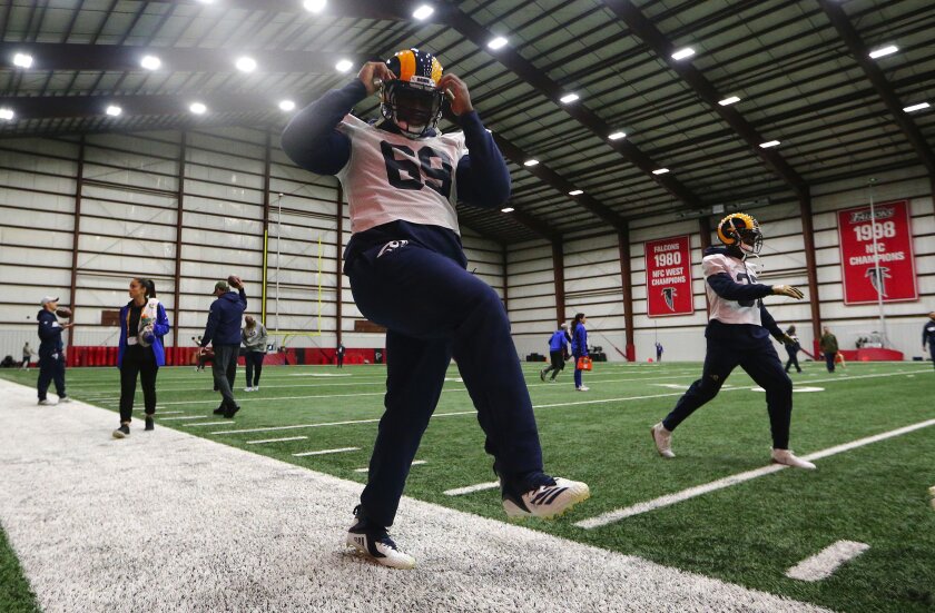 Rams defensive tackle Sebastian Joseph-Day stretches during a practice session.